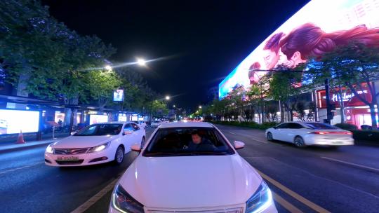 夜晚杭州市延安路车尾行车空镜1视频素材模板下载