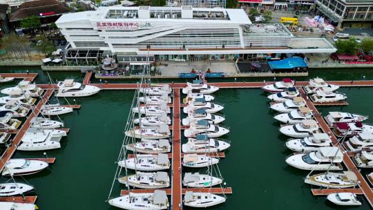 航拍海南三亚游艇旅游中心与帆船港帆船