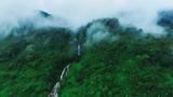航拍绿色森林瀑布云海高清在线视频素材下载