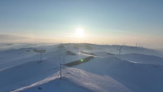 航拍雪原山岭风力发电场