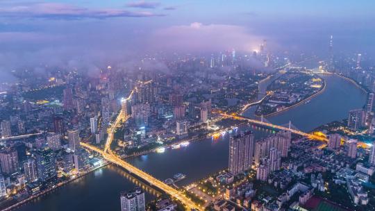 广州珠江岸城市建筑群云雾与路桥夜景航拍