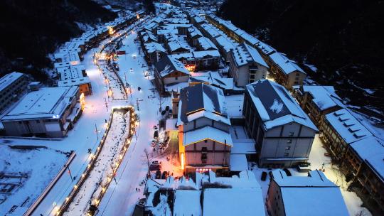 航拍冬天雪景山谷村庄交通道路灯光夜景