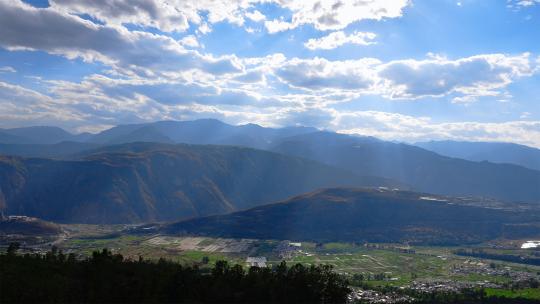 中国云南山川田地光芒云朵延时