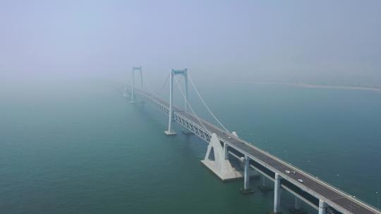 航拍大连雾中的星海湾跨海大桥
