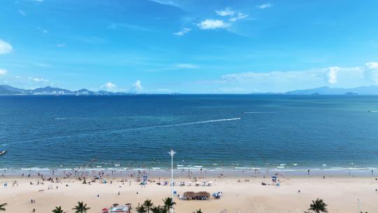 航拍广东惠州大亚湾海岸线沙滩休闲度假人群