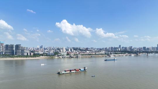 航拍武汉城市长江上行驶的物流货轮