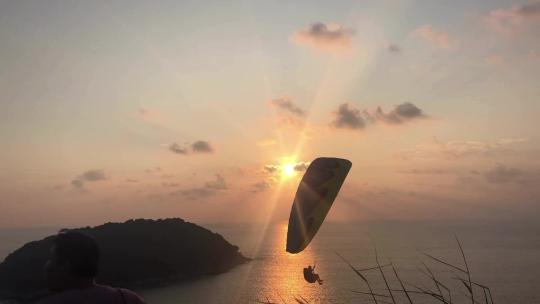 泰国普吉岛风车观景台滑翔伞日落唯美景色