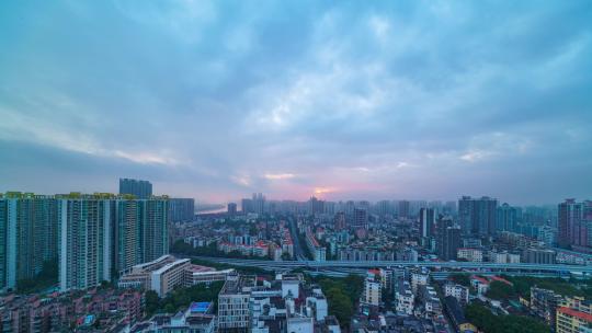 广州城市高楼建筑公路车流与日出朝阳延时