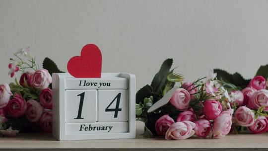 日期为2月14日的日历和题词我用鲜花爱你视频素材模板下载
