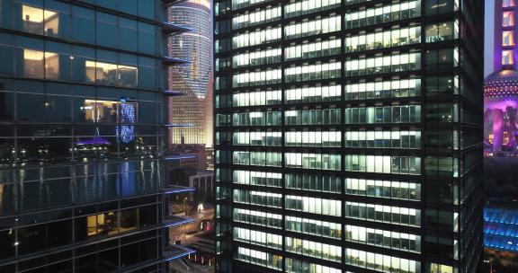 现代城市玻璃幕墙写字楼办公室夜景