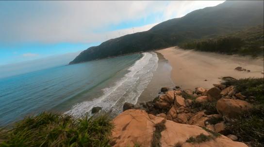 海浪海波浪海岸海洋穿越机风车石滩