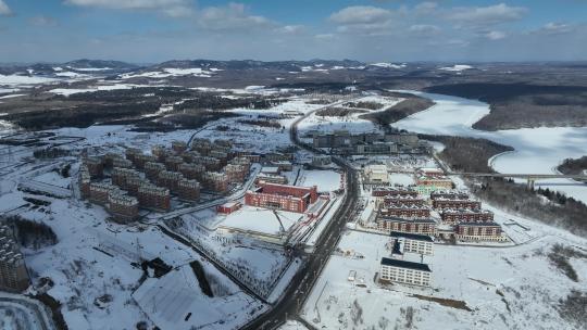 白山市抚松县城市建筑航拍冬季雪原风光