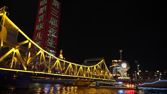 天津夜景世纪钟解放桥两艘海河游船相交视频素材模板下载