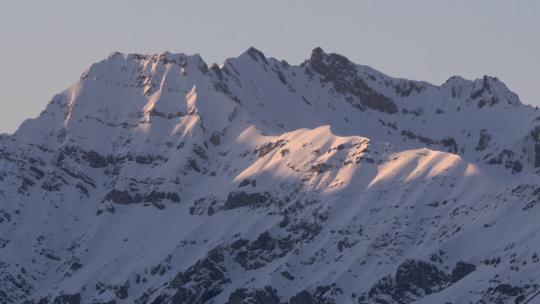 延时摄像夕阳下的雪山视频素材模板下载