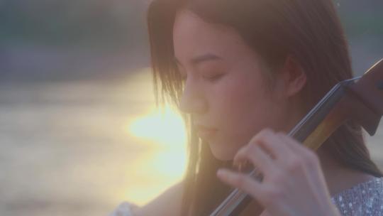美女阳光拉大提琴视频素材模板下载
