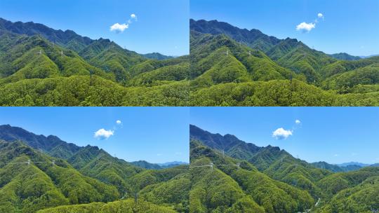 4K蓝天白云航拍森林青山之间的信号塔高清在线视频素材下载