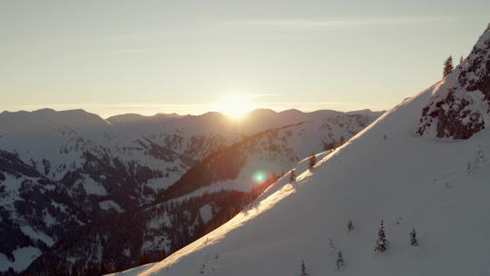 巍峨山峰山脉山峦航拍阳光下的雪山日出朝阳