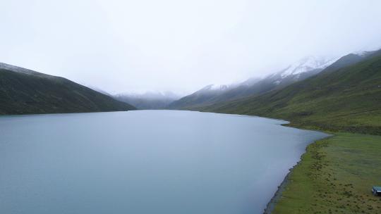 自驾西藏 深入萨普神山 雨天航拍雪山湖泊视频素材模板下载