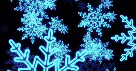 寒冷冬季圣诞新年喜庆发光蓝色雪花飘落背景