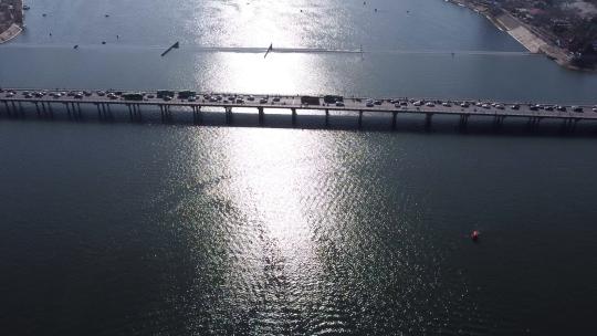 DJI_0588俯视河波光粼粼飞向大桥视频素材模板下载