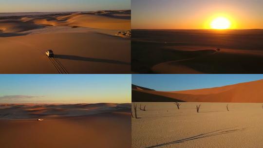 夕阳西下航拍沙漠中行驶的SUV汽车行驶