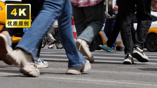街道上行人行走忙碌的脚步斑马线人流脚步