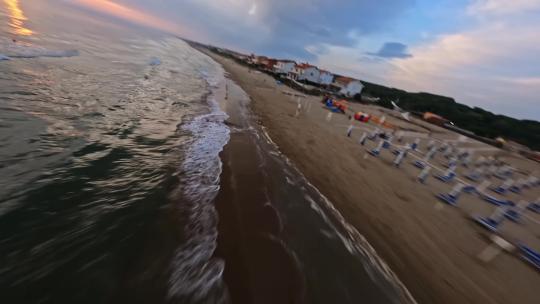 FPV无人机航拍海滩海边度假屋大海日落