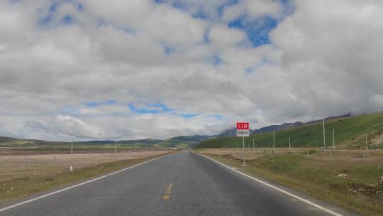 驾驶员视角自驾游川藏线318国道毛垭草原视频素材模板下载