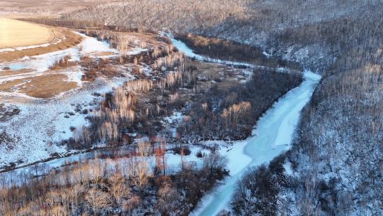 航拍呼伦贝尔早春冰雪山林河湾