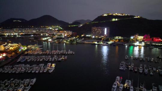 航拍海南三亚游艇旅游中心与帆船港帆船夜景