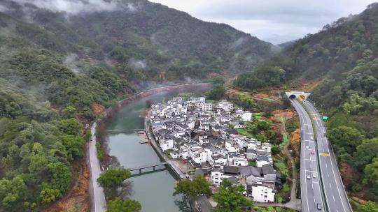 航拍江西婺源高速公路穿过徽派古民居上坦村