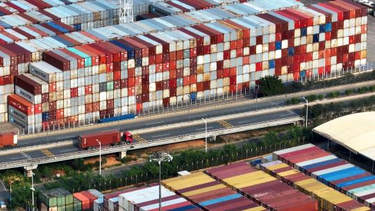 航拍城市出口货运港口物流集装箱码头车流
