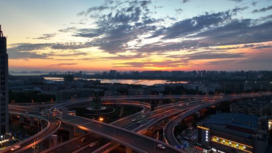 航拍城市夕阳晚霞立交桥交通道路车流夜景