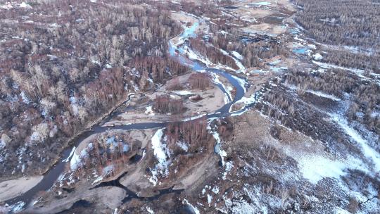 大兴安岭早春残雪消融山谷森林河