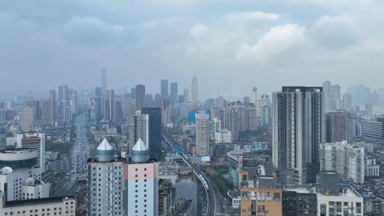 航拍武汉市中心高楼群与立体交通轻轨列车