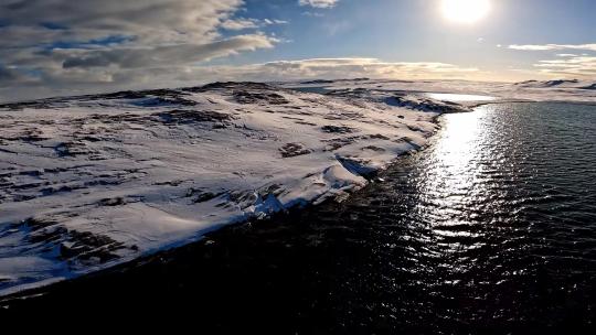 FPV无人机航拍冬日雪景海岸海浪群岛海鸟