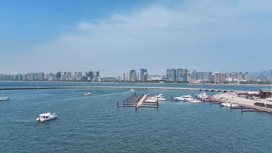 航拍沿海城市海岸线游艇码头