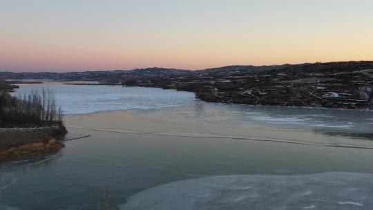 航拍清晨日出陕北冰封的河