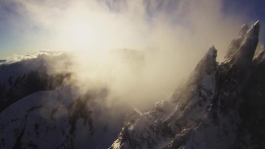 航拍雪山直升机飞跃山峰登顶登高企业发展视频素材模板下载