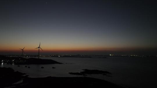 夜晚海边风车航拍大海夜景自然风光晚上风景