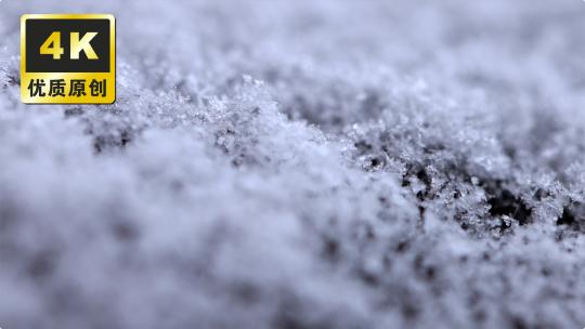 微观雪花冬季雪花飘落下雪地面雪花上霜