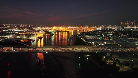 城市航拍车流行驶在跨海大桥上夜景灯光港口