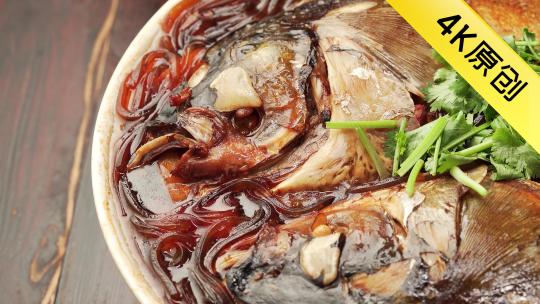 中国东北地方特色美食粉条炖鱼头烹饪过程视频素材模板下载