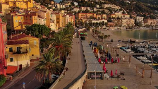 城市航拍海滨小镇海边跑步法国芒通小镇视频素材模板下载