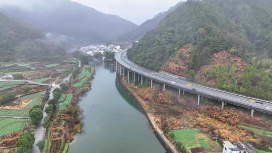 航拍江西婺源高速公路穿过徽派古民居上坦村