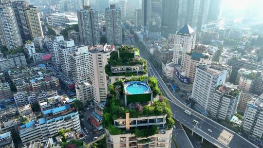 航拍贵州贵阳写字楼酒店楼顶的空中游泳池