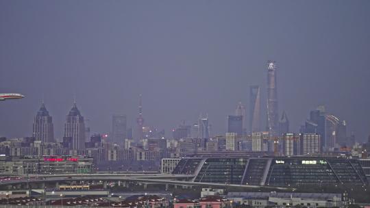 实拍上海城市陆家嘴飞机飞过城市视频素材模板下载