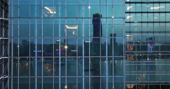 现代城市玻璃幕墙写字楼办公室夜景
