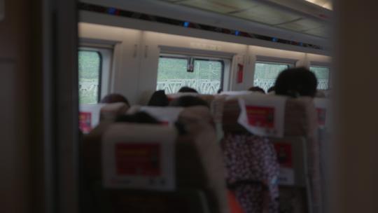 高速行驶的高铁 前景乘客远景车窗外风景视频素材模板下载
