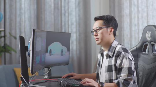 亚洲男设计师在电脑上无聊地制作电动汽车的3D模型时，双手放在脸颊上